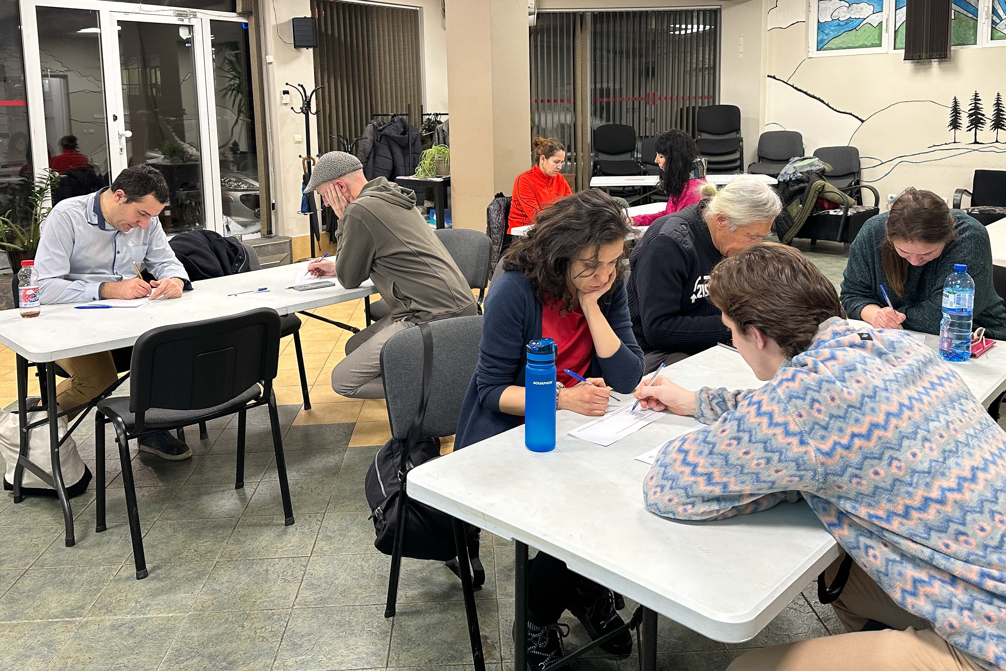 English Club class members work on an assignment.